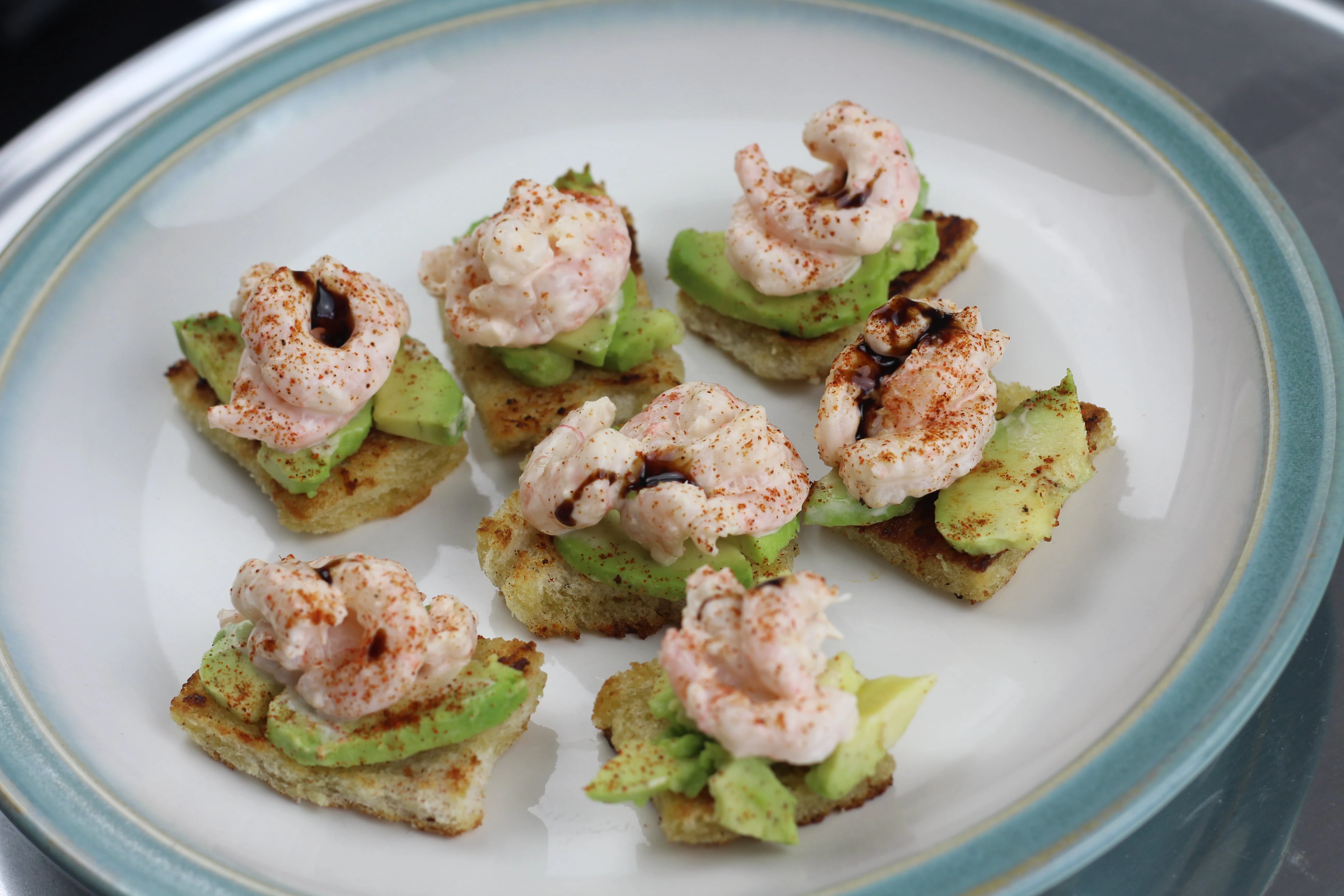 Photo of one of Gav's recipes of shrimp and avocado on crustini bread.